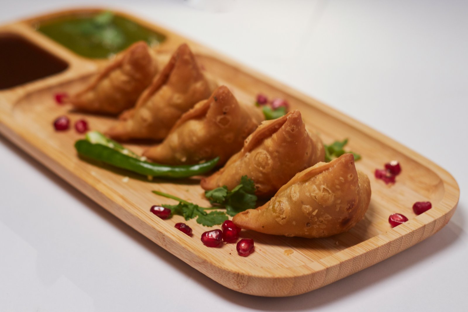 Hot Punjabi samosas with mint chutney